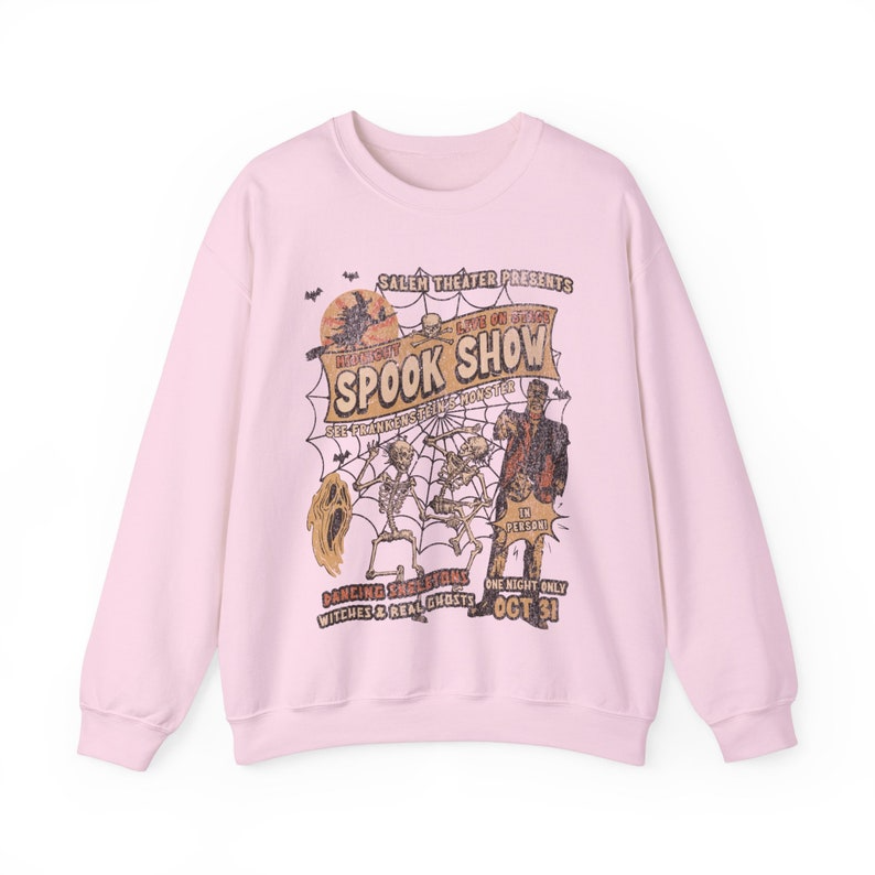 a pink sweatshirt with the words spook show on it