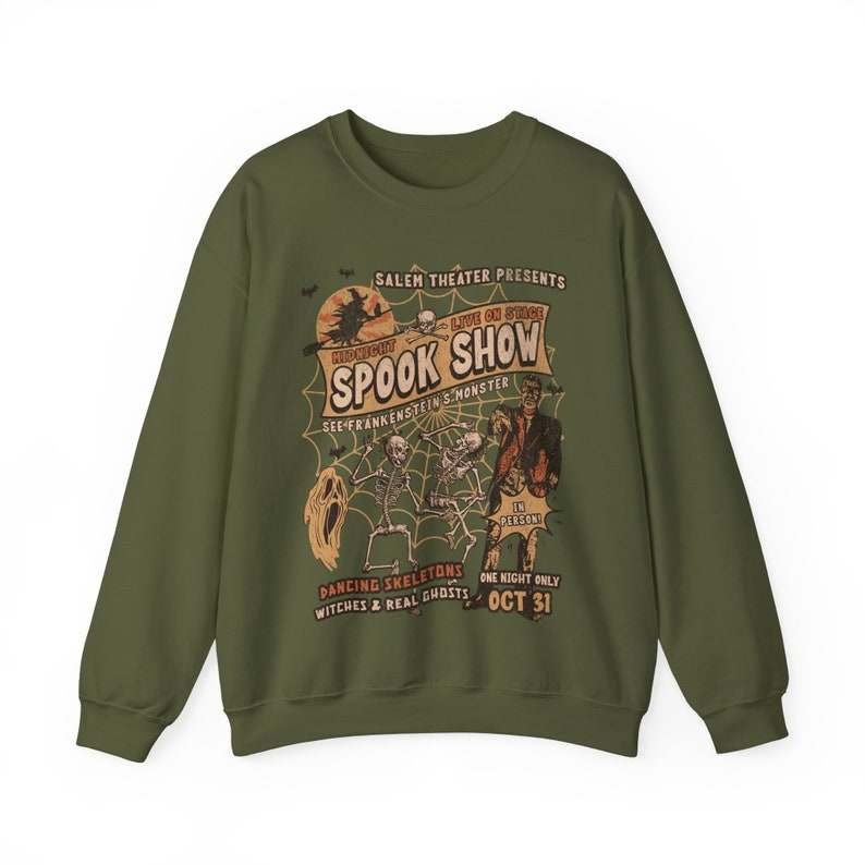 a green sweatshirt with an image of a cartoon character on it