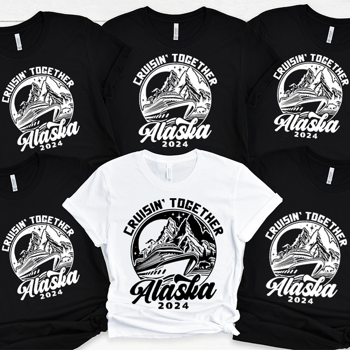a group of black and white t - shirts with the words alaska printed on them