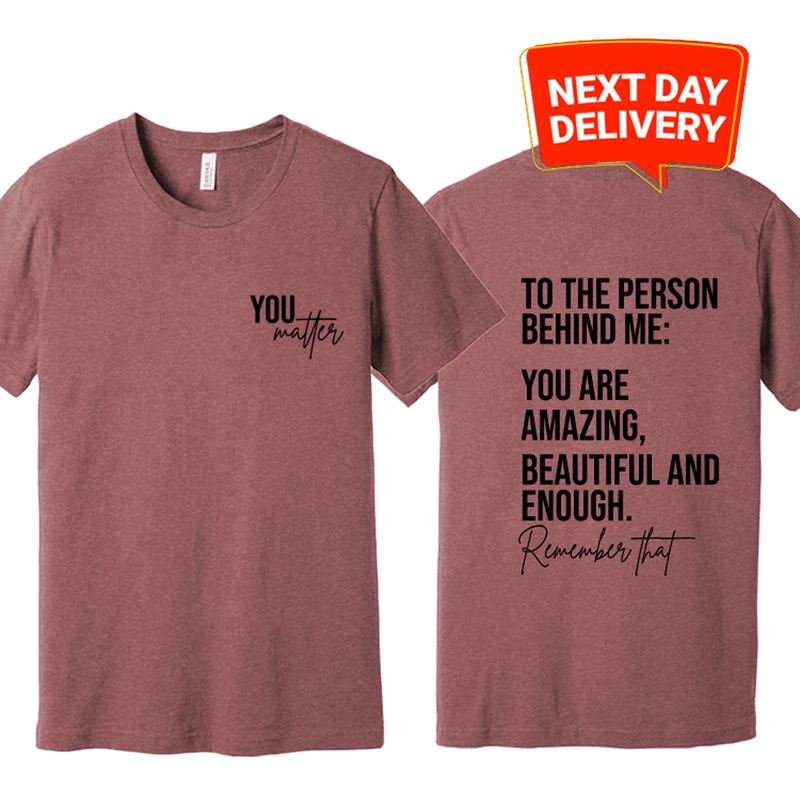 a t - shirt with a message on the front and back of it