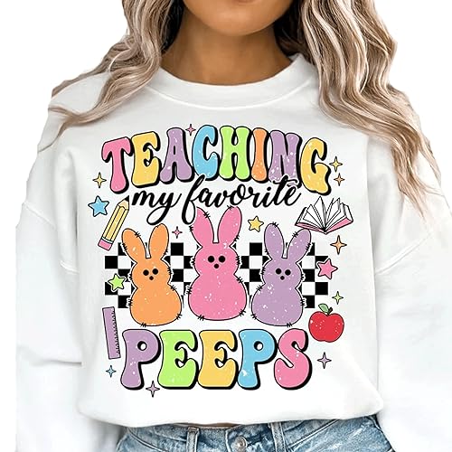 a woman wearing a white sweatshirt that says teaching is my favorite pepps