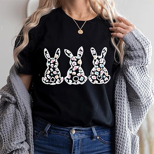 a woman wearing a black shirt with three bunnies on it
