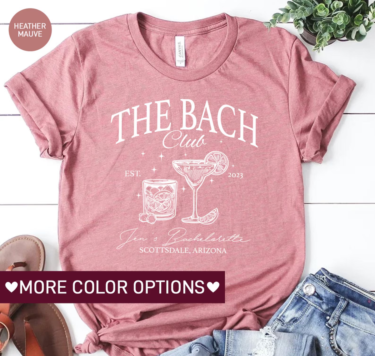 a t - shirt with the words, the beach club, and a glass of