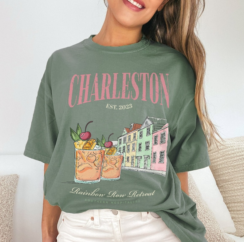 a woman wearing a t - shirt that says charleston