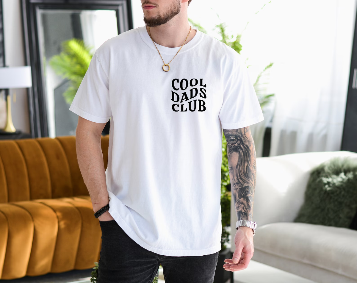 a man standing in a living room wearing a t - shirt that says cool days