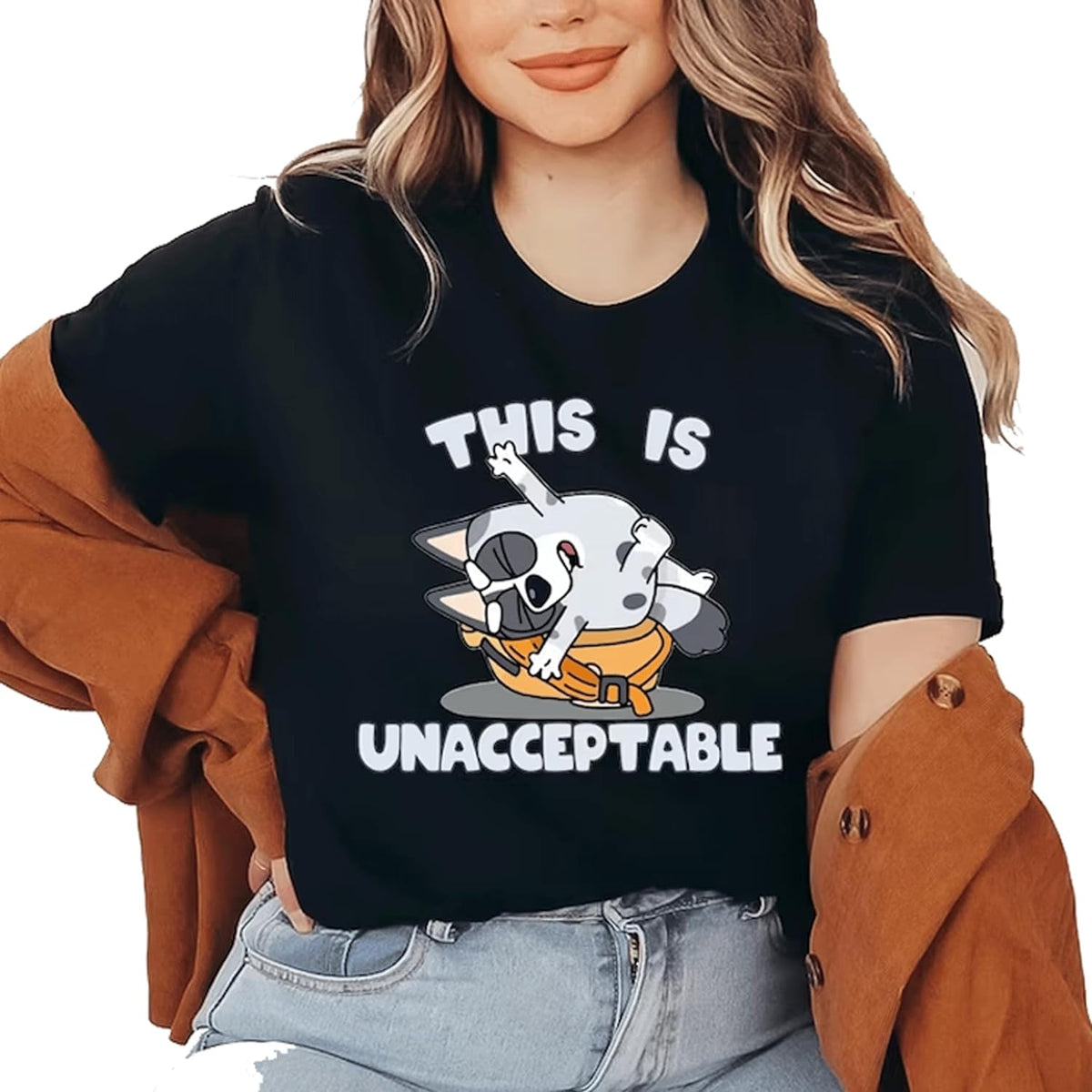 a woman wearing a black shirt that says this is unacceptable