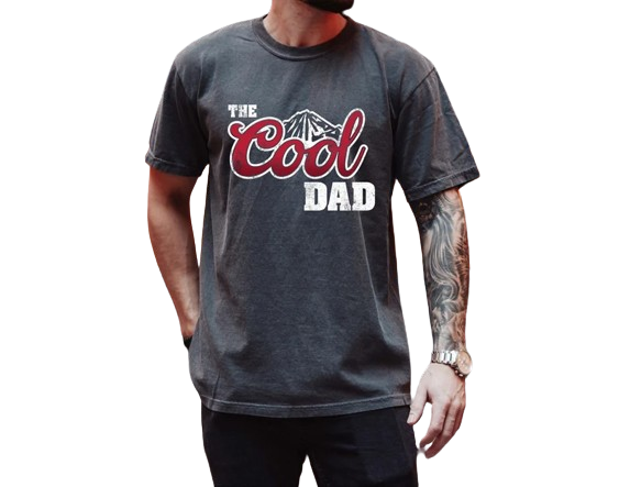 a man with a beard wearing a t - shirt that says the cool dad