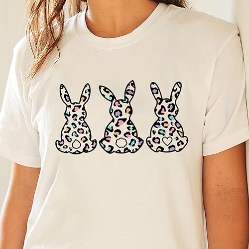 a woman wearing a white t - shirt with three bunnies on it